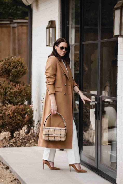 Wear a camel coat with a monochrome outfit, layer it over a classic ...