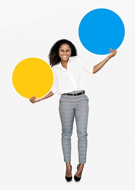 Cheerful woman holding colorful round boards | Free PSD