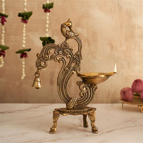 Beautifully Crafted Brass Peacock Diya - A Stunning and Auspicious Pie ...