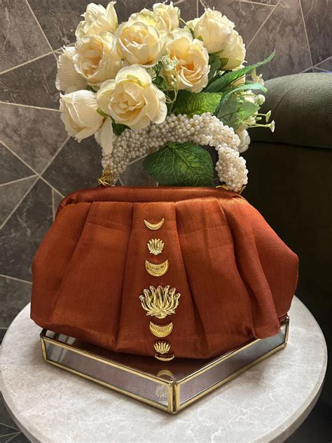 “Divine Lotus Glow Potli – Rust Orange” The Heere Zewar Edit – Label By ...