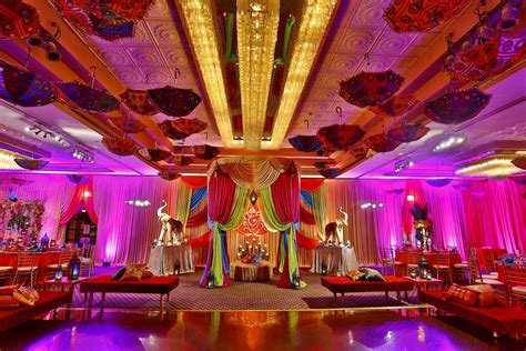 » An eye catching flower wall and two floral centerpieces in this ...