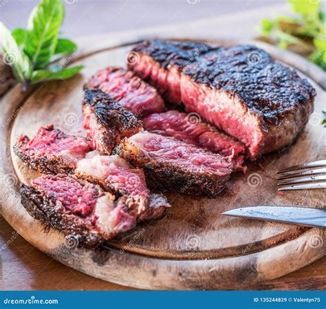Medium Rare Ribeye Steak or Beef Steak Stock Image - Image of wooden ...