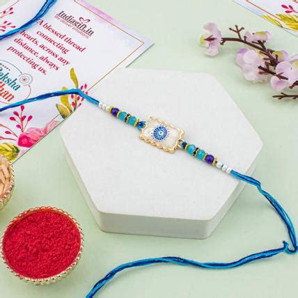 Send Beautiful Evil Eye Rakhi Online in India at Indiagift.in