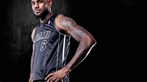 Download Miami Heat Lebron In Black Jersey Wallpaper | Wallpapers.com