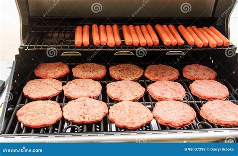 Hamburgers and Hot Dogs on Grill Stock Photo - Image of grill, patties ...