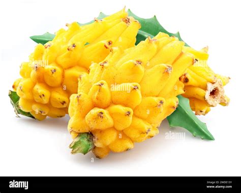 Yellow dragon fruits with green leaves isolated on white background ...
