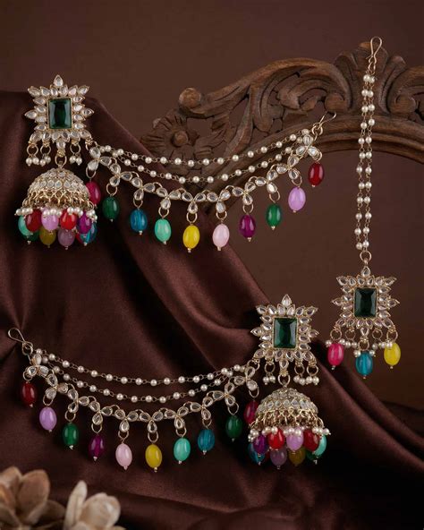 Multi Kaur Mirror Bahubali Jhumka with Statement Kaan Chain and Teeka ...