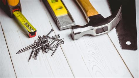 Animation of diy tools and nails on white wooden boards | Premium Stock ...