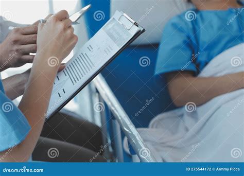 Injured Patient Showing Doctor Broken Wrist and Arm with Bandage in ...