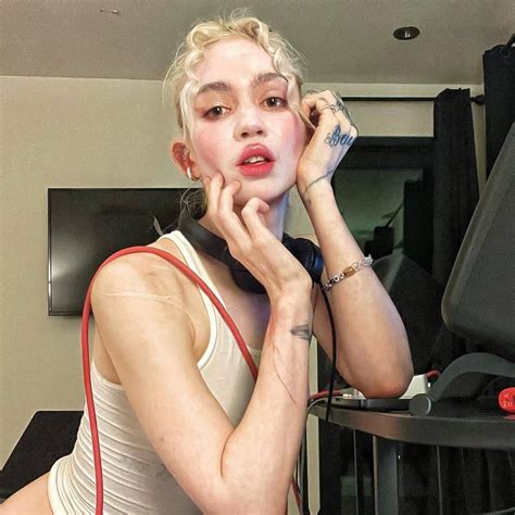 Grimes' Face Tattoo: Photo, Meaning