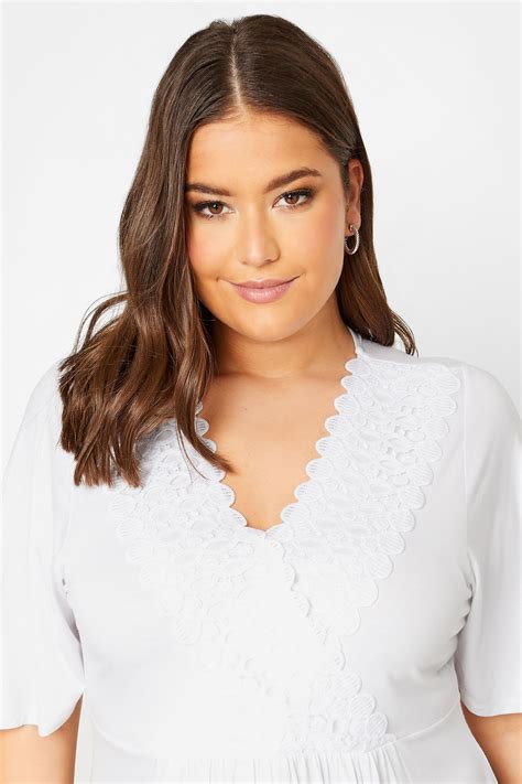 YOURS Plus Size White Crochet Trim Peplum Tunic Top | Yours Clothing