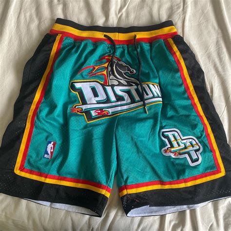 Pistons just don shorts Large but fits like... - Depop