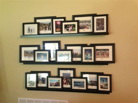Ikea shelves, vacation photos gallery wall | Gallery wall, Photo wall display, Photo arrangement