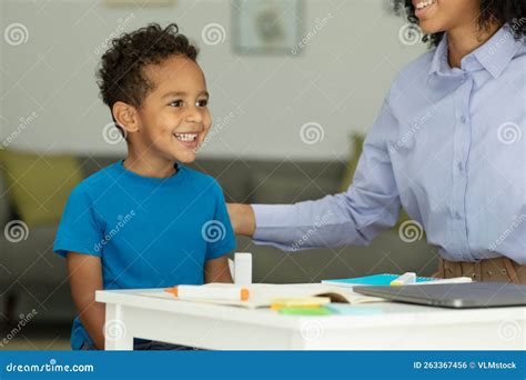 Happy Baby Boy is Sitting at the Table, Having Fun with the Teachers ...