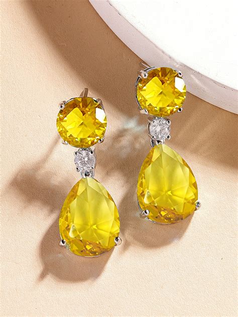 Karatcart Luxurious Yellow American Diamond Stone Drop Earrings for Wo