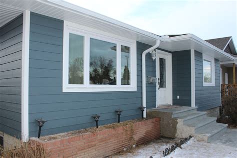 Evening blue Hardie board with white trim | Ranch house exterior ...