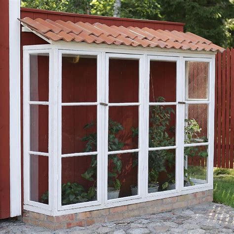 Charming Greenhouse Made from Old Windows