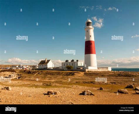 white and red large lighthouse isle of portland weymouth building ...