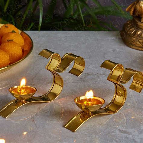 Elegant OM Handled Brass Diya (Set of 2)