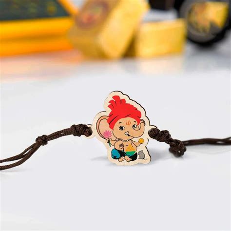 Buy Handmade Ganapati Wooden Kids Rakhi With Roli Chawal Online On Zwende