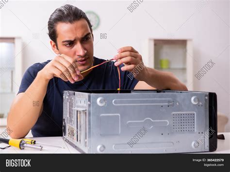Image result for Man Repairing Computer