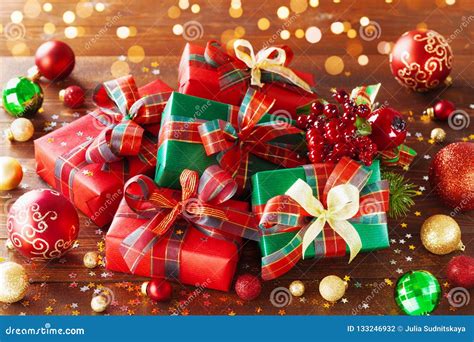 Christmas Gift Boxes with Holiday Lights on Wooden Background Stock ...