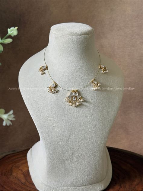 INVISIBLE CHAIN WITH LOTUS PENDANT IN WHITE KUNDAN STONE – AARVEE JEWELLERY