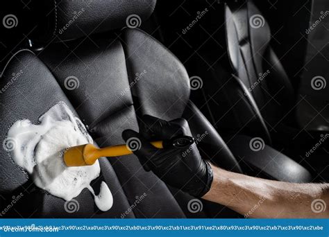 Process of Foam and Detergent Cleaning Leather Seat Using Brush. Worker ...