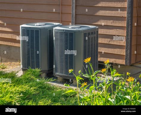 Air conditioning units outside an apartment complex Stock Photo - Alamy