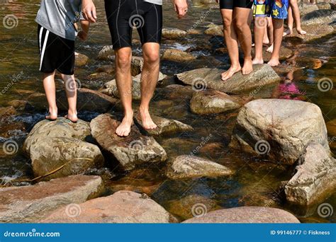 Feet Crossing the Headwaters at Itasca Park Editorial Photography ...