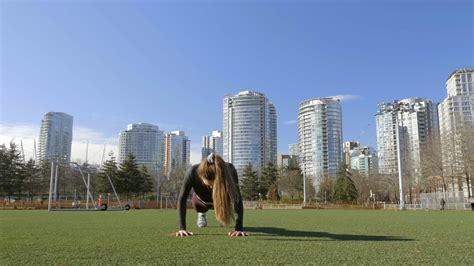 Young woman doing burpees exercise in park slow motion shot | Premium ...