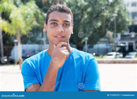 Shy Latin American Guy with Blue Shirt Stock Image - Image of latino ...