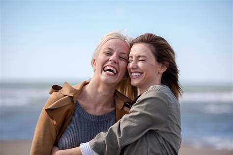 Women Smiling And Enjoying Life at Beach 12645382 Stock Photo at Vecteezy