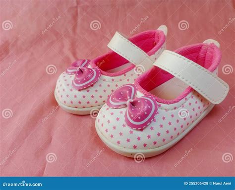 Cute Pink Baby Shoes for Little Girl on Pink Background Stock Photo ...