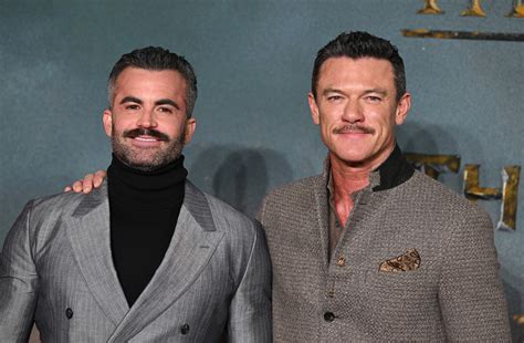Luke Evans shows off skimpy swimwear with boyfriend Fran Tomas