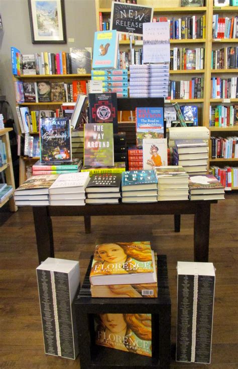 Stacked tables give height and the cube on the floor gives this ...