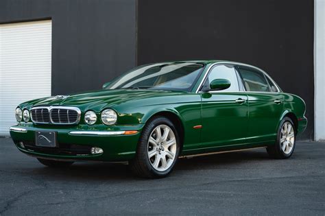 British Racing Green Vinyl Wrap on 2005 Jaguar XJ8 L | Apex Customs