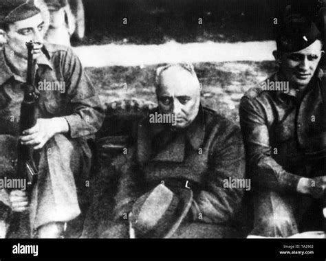 The former head of the German Labor Front, Robert Ley, guarded by ...