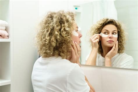 Young beautiful woman with applied adhesive under-eyes patches for skin ...