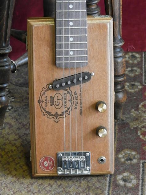 4 String Cigar Box Guitar Lessons 的图像结果