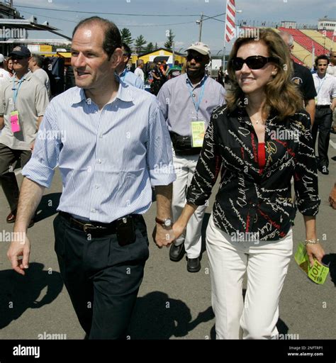 New York Gov. Eliot Spitzer, left, walks with his wife Silda Wall ...