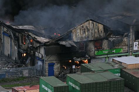 Massive warehouse blaze erupts in west London, triggering explosions ...