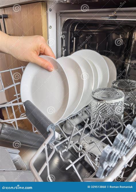 Close Up Woman Taking Out Clean Dishes from Dishwasher Machine ...