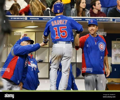 Chicago Cubs' Darwin Barney is congratulated by manager Rick Renteria ...