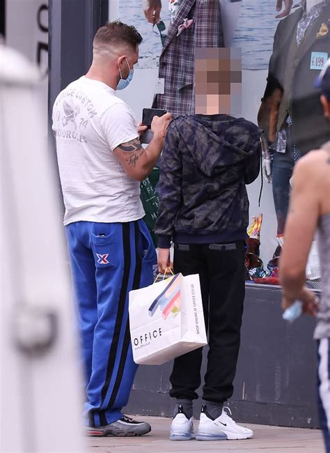 Tom Hardy cuts a casual figure as he goes shopping with his eldest son ...