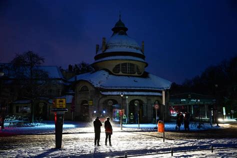 Emergency vehicles from the aid organization "Die Johanniter" pick up residents of a retirement home in Berlin, Germany, Saturday, Jan. 3, 2025, during a power cut in south-west Berlin after a fire on a cable bridge. (Michael Ukas/dpa via AP)