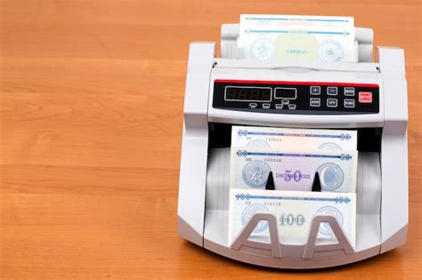 Money from cuba in a counting machine | Premium Photo