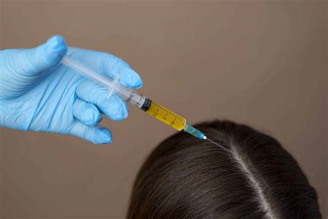 hand-giving-injection-patient-high-angle | Dr Reema Arora