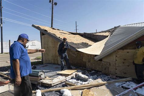 Local resident Keaton Boudreaux leaves after surveying his family run ...