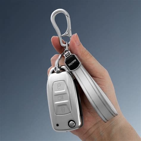 Keyzone® silver dust TPU Key Cover & keychain for Curvv, Nexon, Harrie